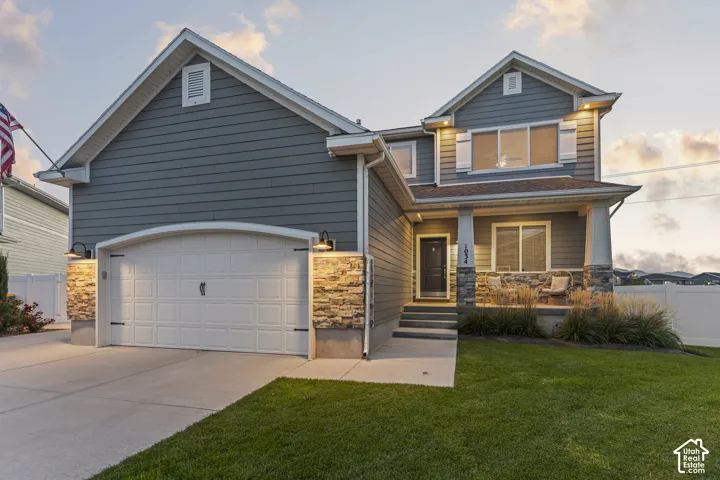 Two-story exterior with horizontal siding and stone accents