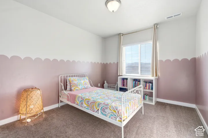 Recessed window with blinds, built-in shelving, flush-mount ceiling light, and wall-to-wall carpeting