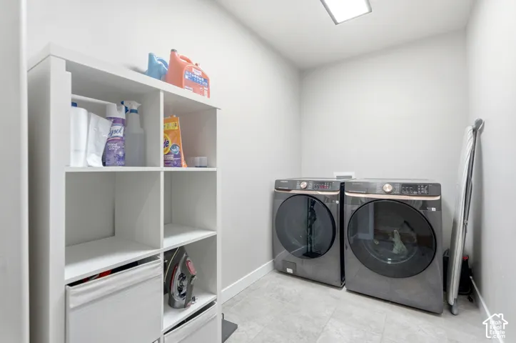 Laundry area with a square ceiling light and tile flooring