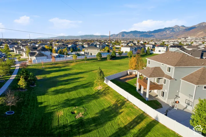 Contemporary residence with a multi-level deck, covered patio, and a fenced backyard
