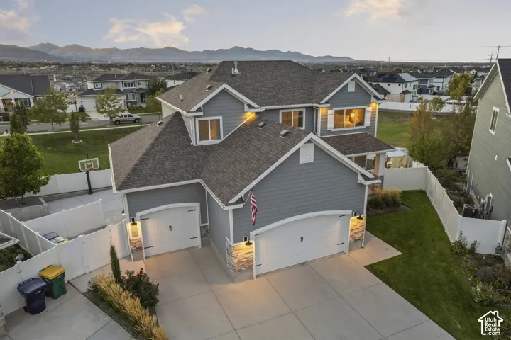 Two-story home with a multi-gabled roofline and attached two-car garage
