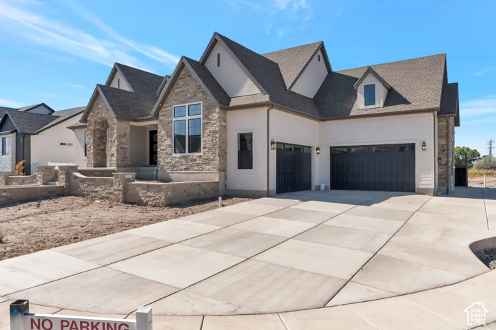 Stone and siding exterior with a multi-gabled roofline