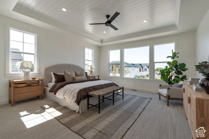 Tray ceiling with shiplap-style finish and recessed lighting