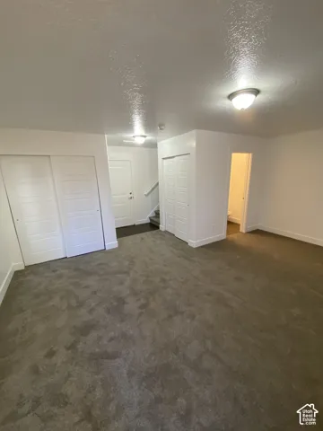 Broadloom carpeting and crisp white walls throughout