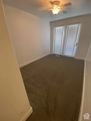 Recessed lighting, ceiling fan, neutral wall paint, carpet flooring, and private exterior access