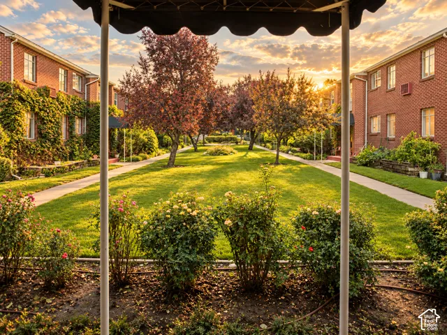 Expansive central lawn bordered by concrete pathways