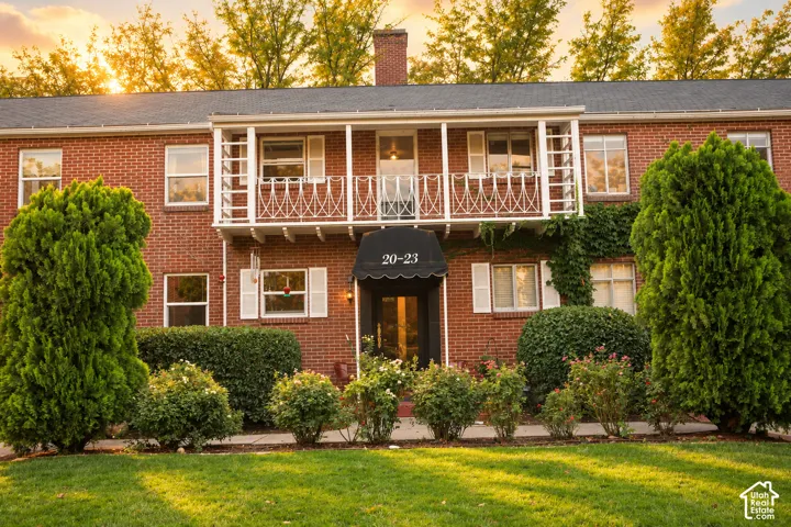 Brick exterior with white shutters