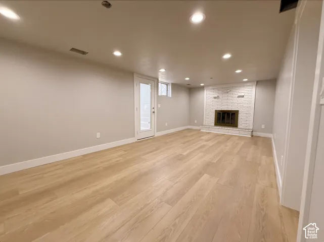 Light wood-finish flooring complements the neutral wall tones