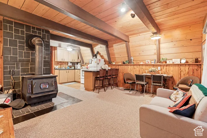 Main level living room with fireplace and kitchen.