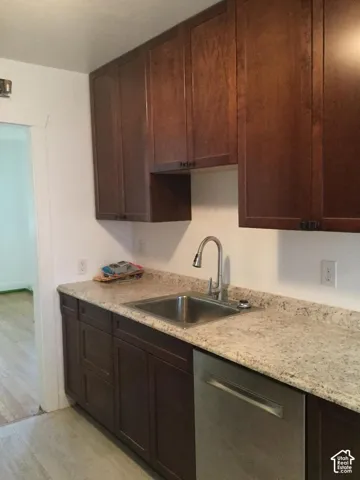 Dark wood-finish cabinetry with silver hardware