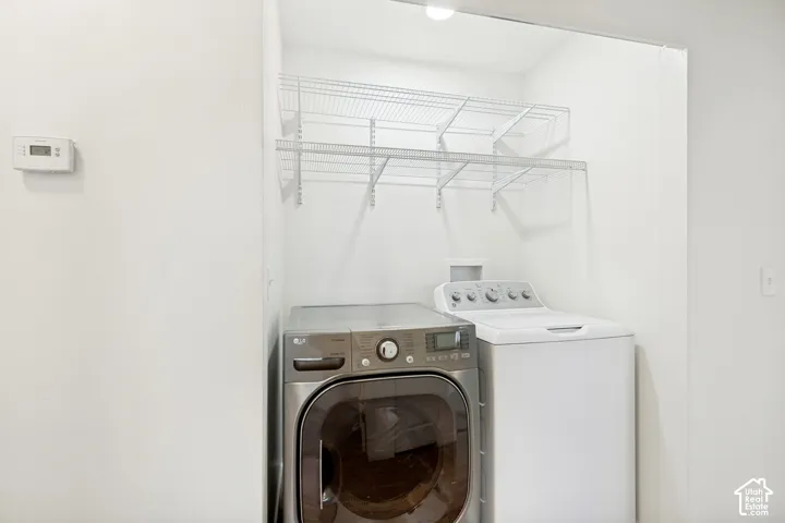 White washer and dryer units with wire shelving