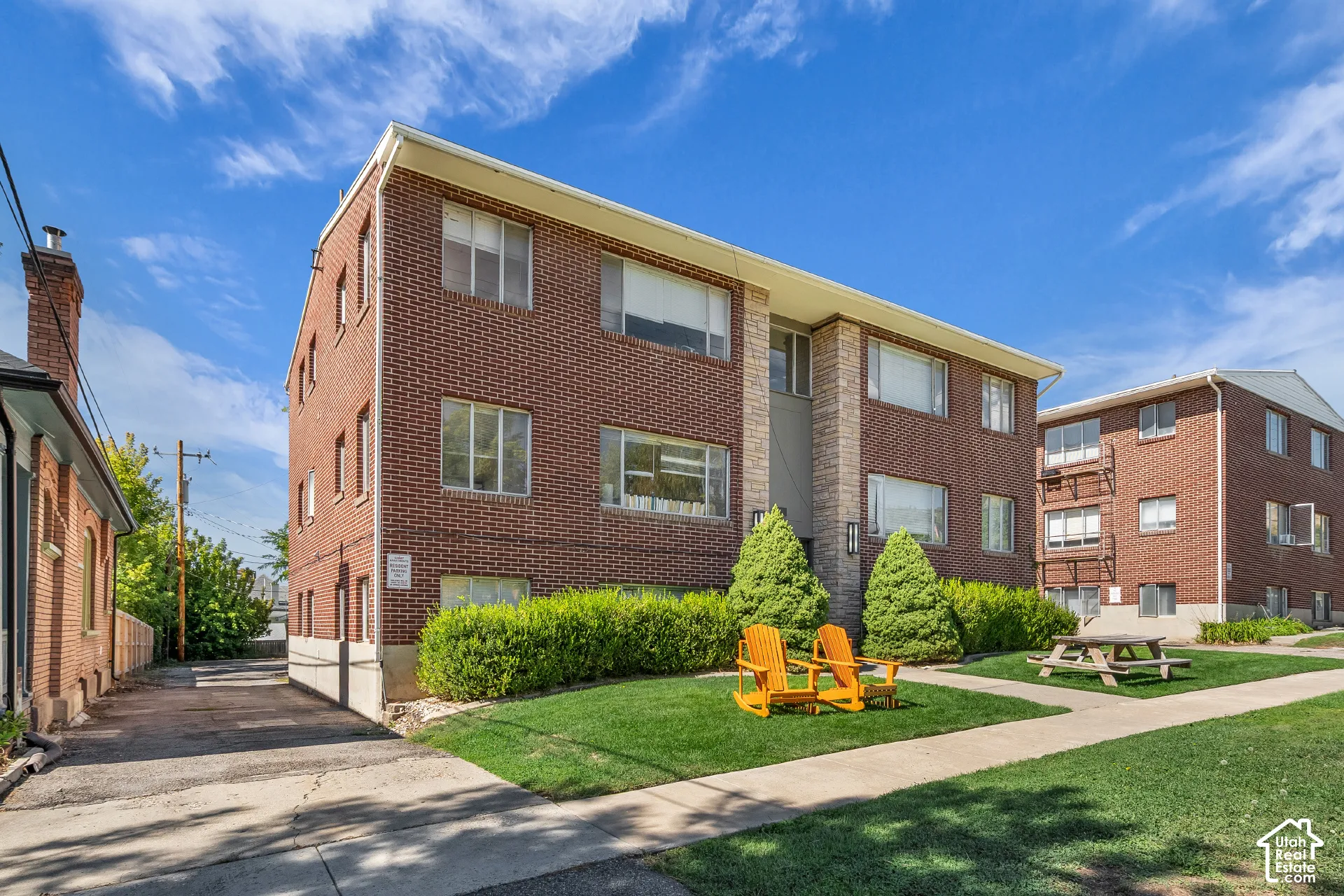 Brick exterior facade with stone-clad accents and multiple windows