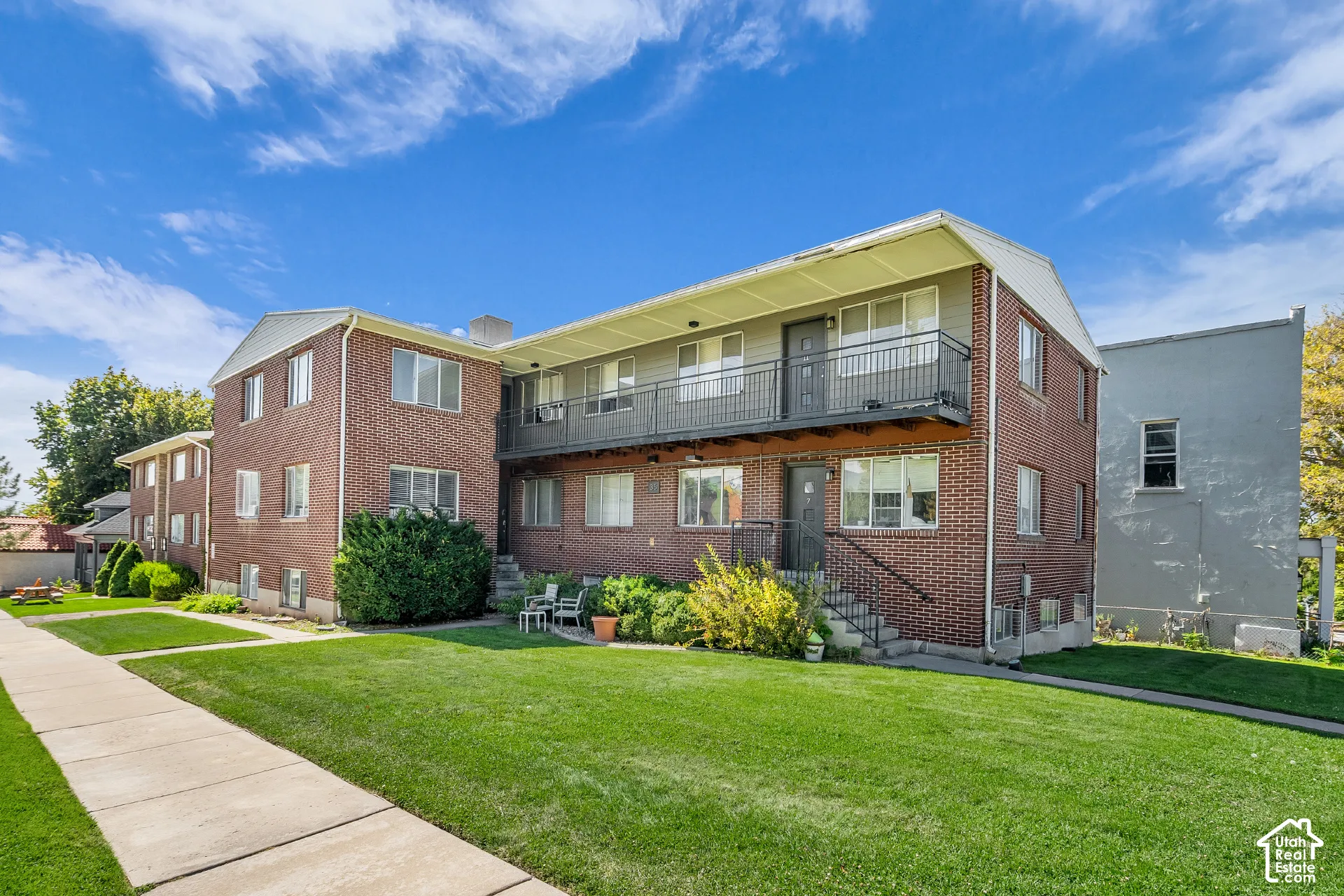 Brick exterior with a second-story balcony
