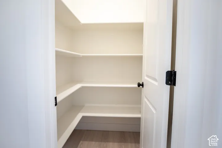 Walk-in pantry adjacent to kitchen.