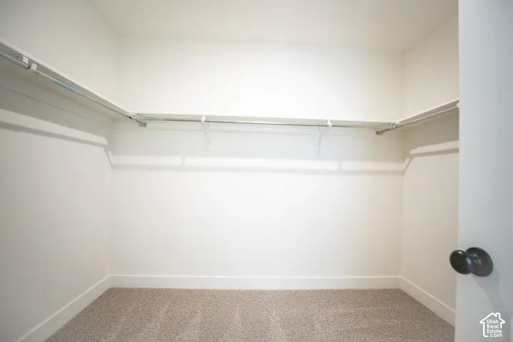 Spacious walk-in closet as part of primary suite.