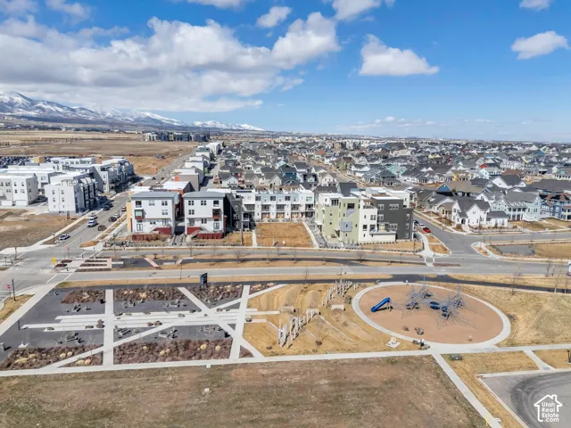 Expansive community featuring diverse architectural styles, a landscaped public park, and a dedicated playground area