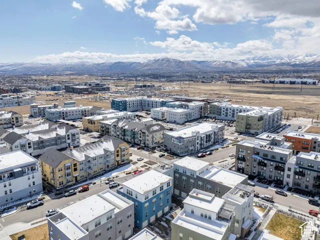 Mixed-use community featuring multi-story residential buildings with diverse exterior finishes
