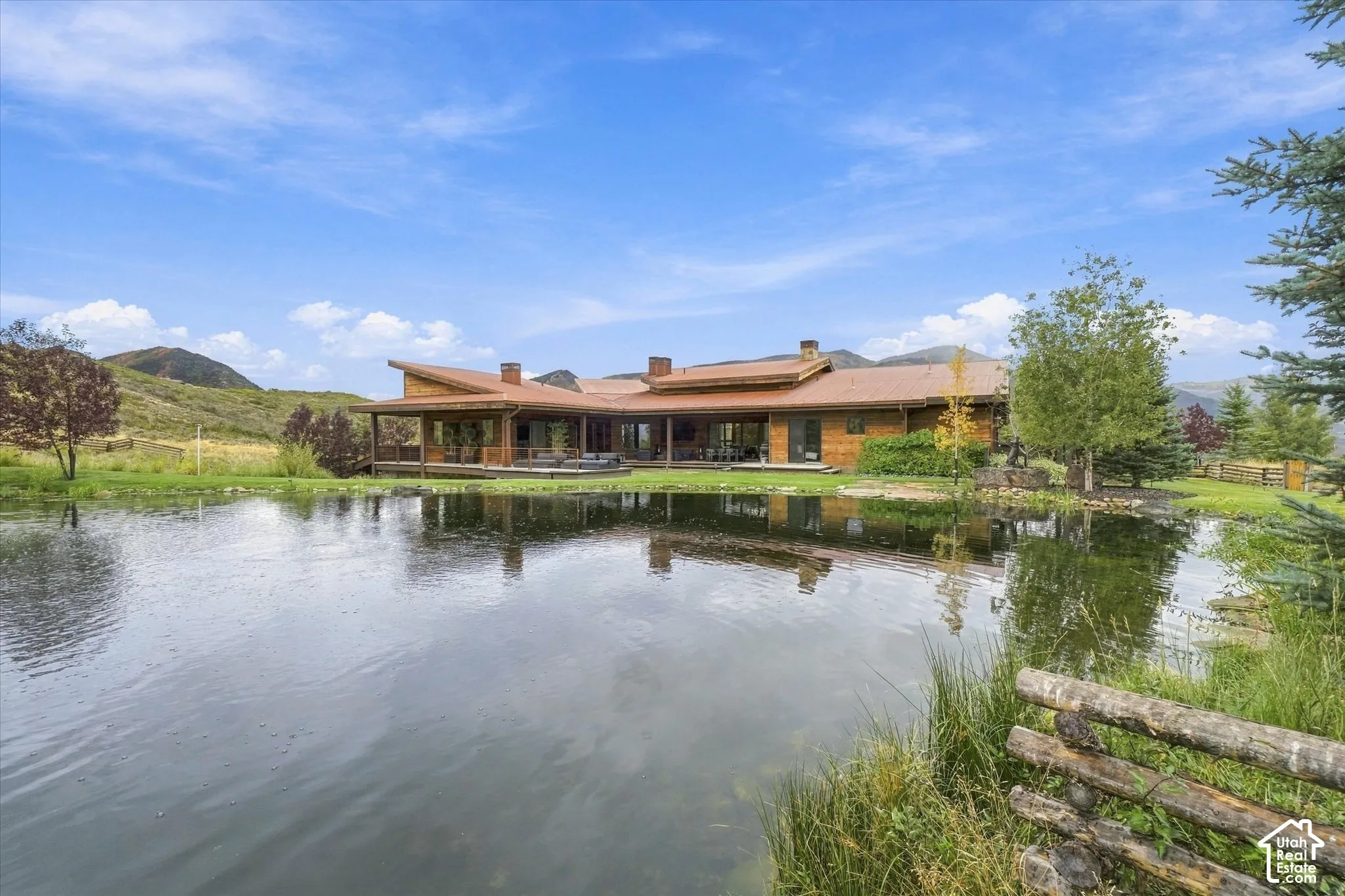 Expansive pond with a wooden fence