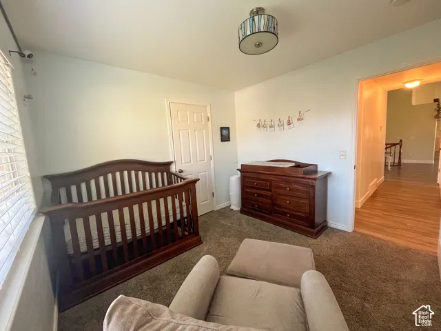 Recessed lighting, wood-finish flooring, and light wall paint
