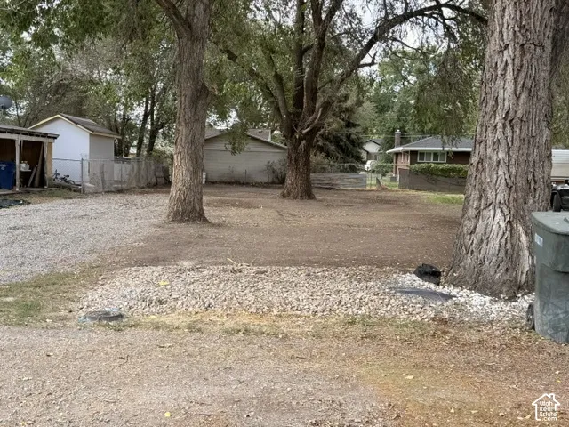 Expansive outdoor area featuring mature trees