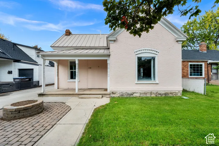 Brick exterior with stone foundation and decorative window trim