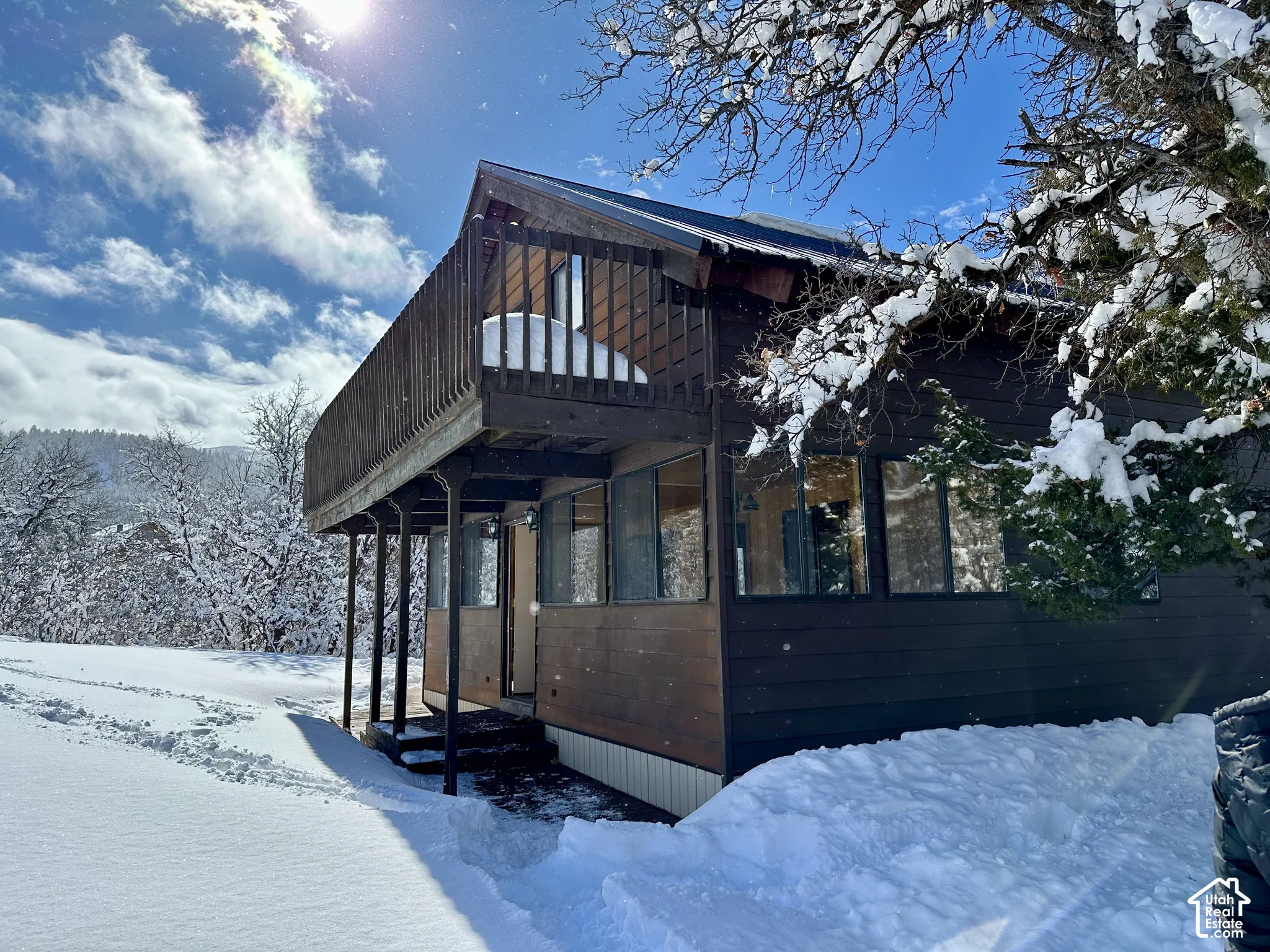 Multi-level exterior with dark wood siding
