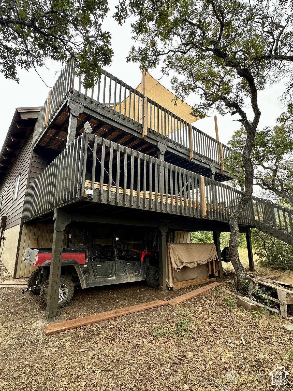 Multi-level outdoor decks with dark wood railings