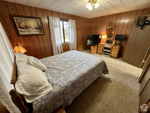 Wood-paneled walls and a textured ceiling