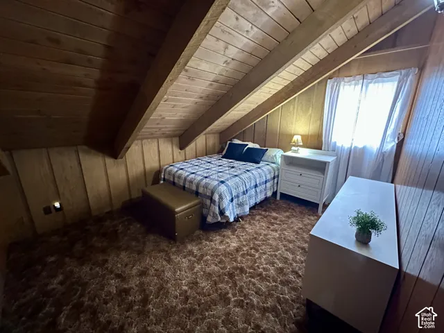 Wood-paneled walls and ceiling with exposed beams