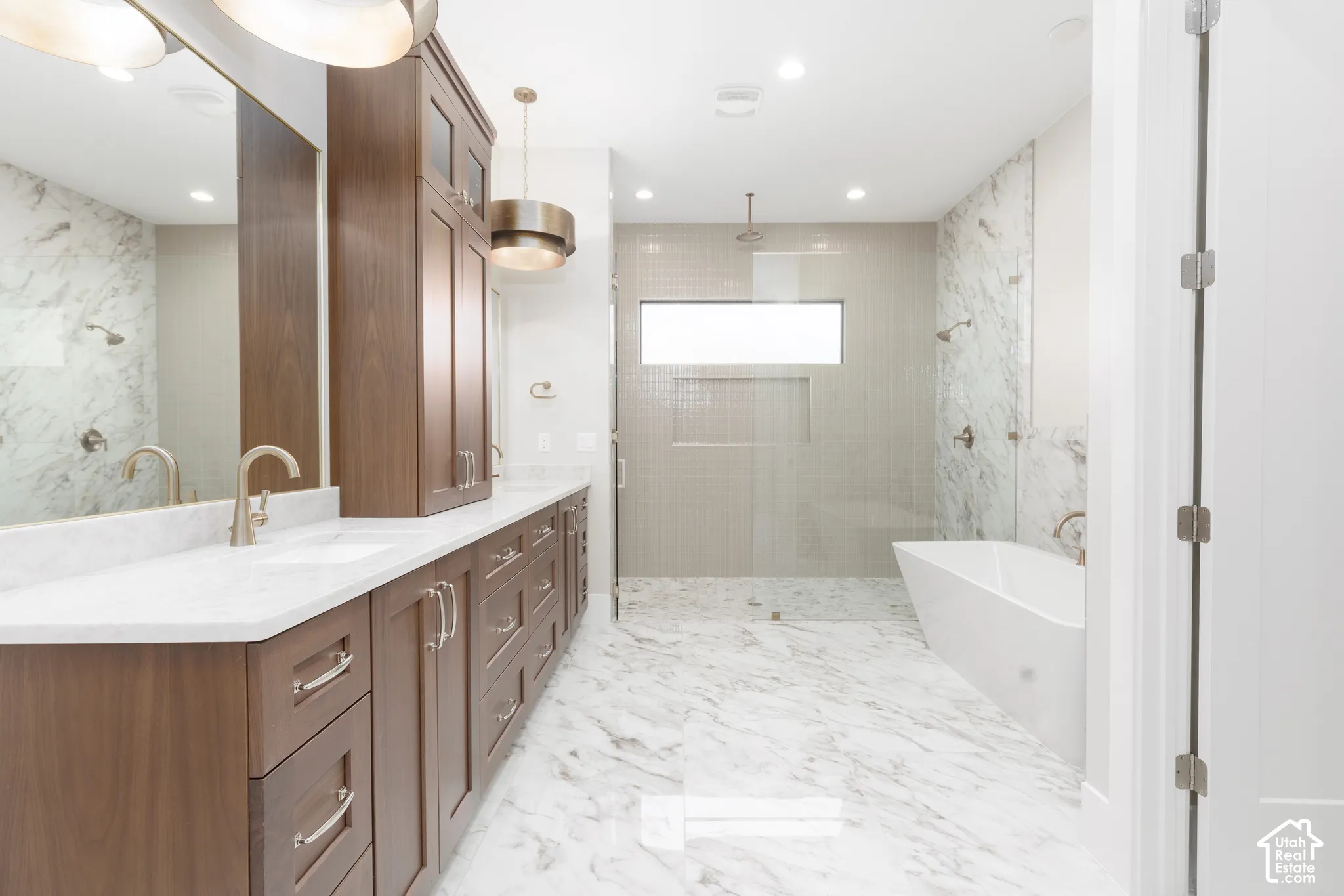 Dual vanity with wood-finish cabinetry and white countertops