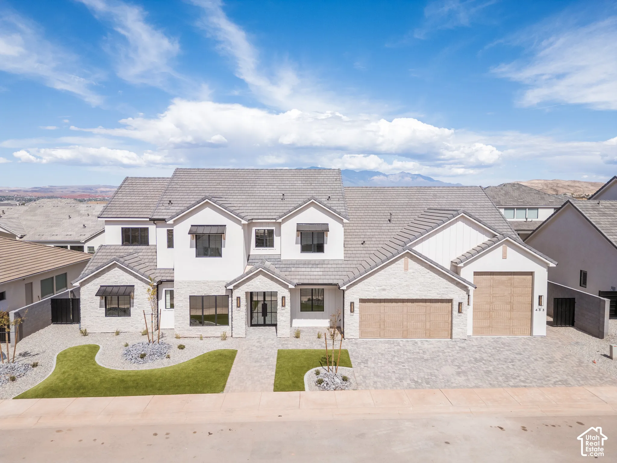 Modern exterior with light brick and white stucco finishes