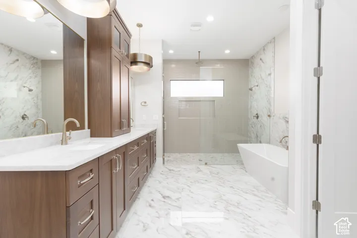 Dual vanity with wood-finish cabinetry and white countertops