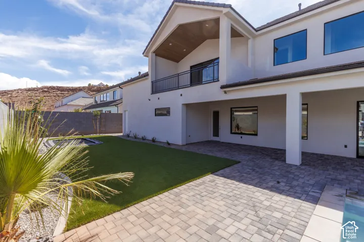 Expansive paver patio with a covered outdoor living area