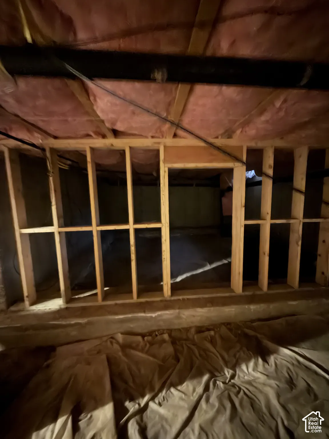 Not high enough to qualify as a basement, but a very spacious crawling space with plenty storage room.