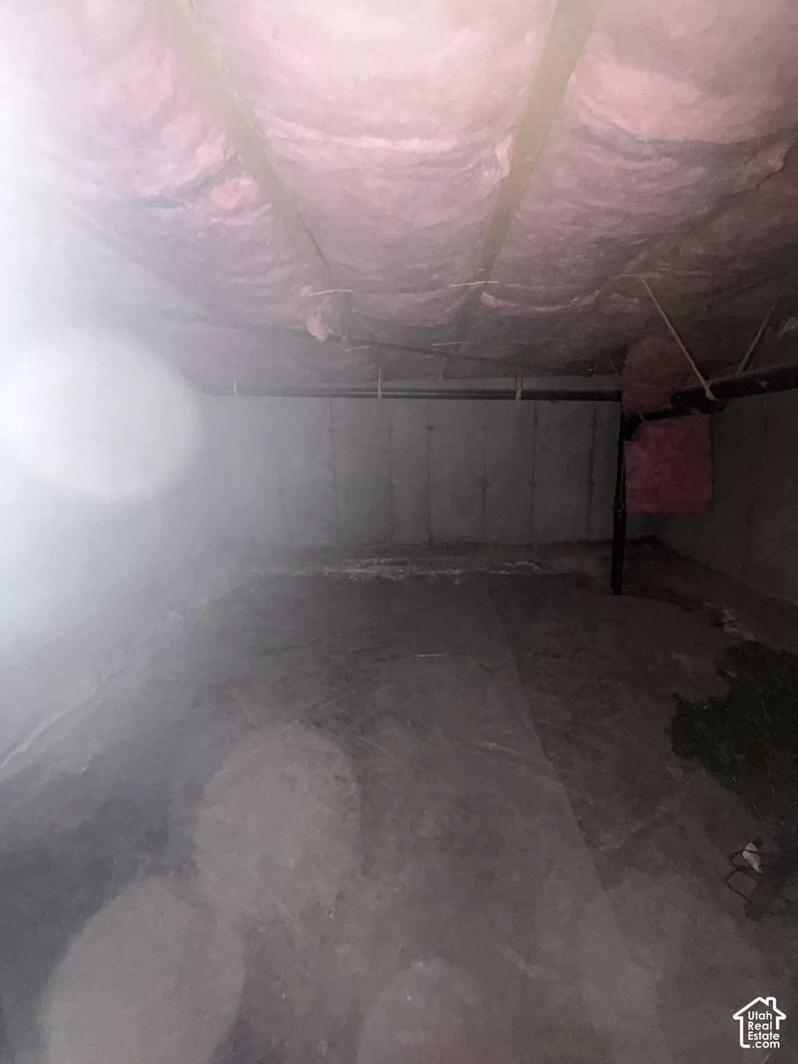 Not high enough to qualify as a basement, but a very spacious crawling space with plenty storage room.