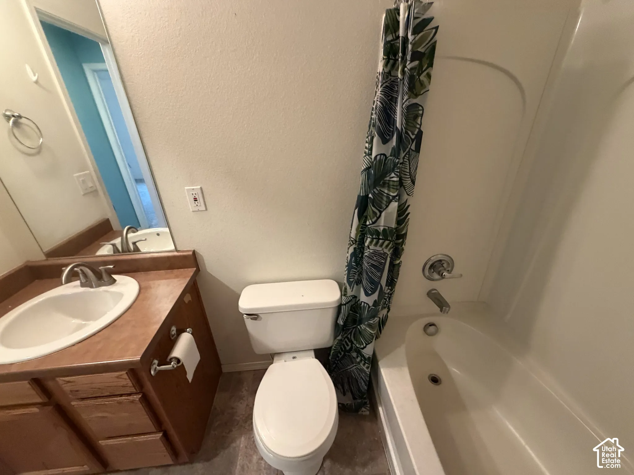 Built-in vanity with integrated sink, chrome faucet, and full-width mirror
