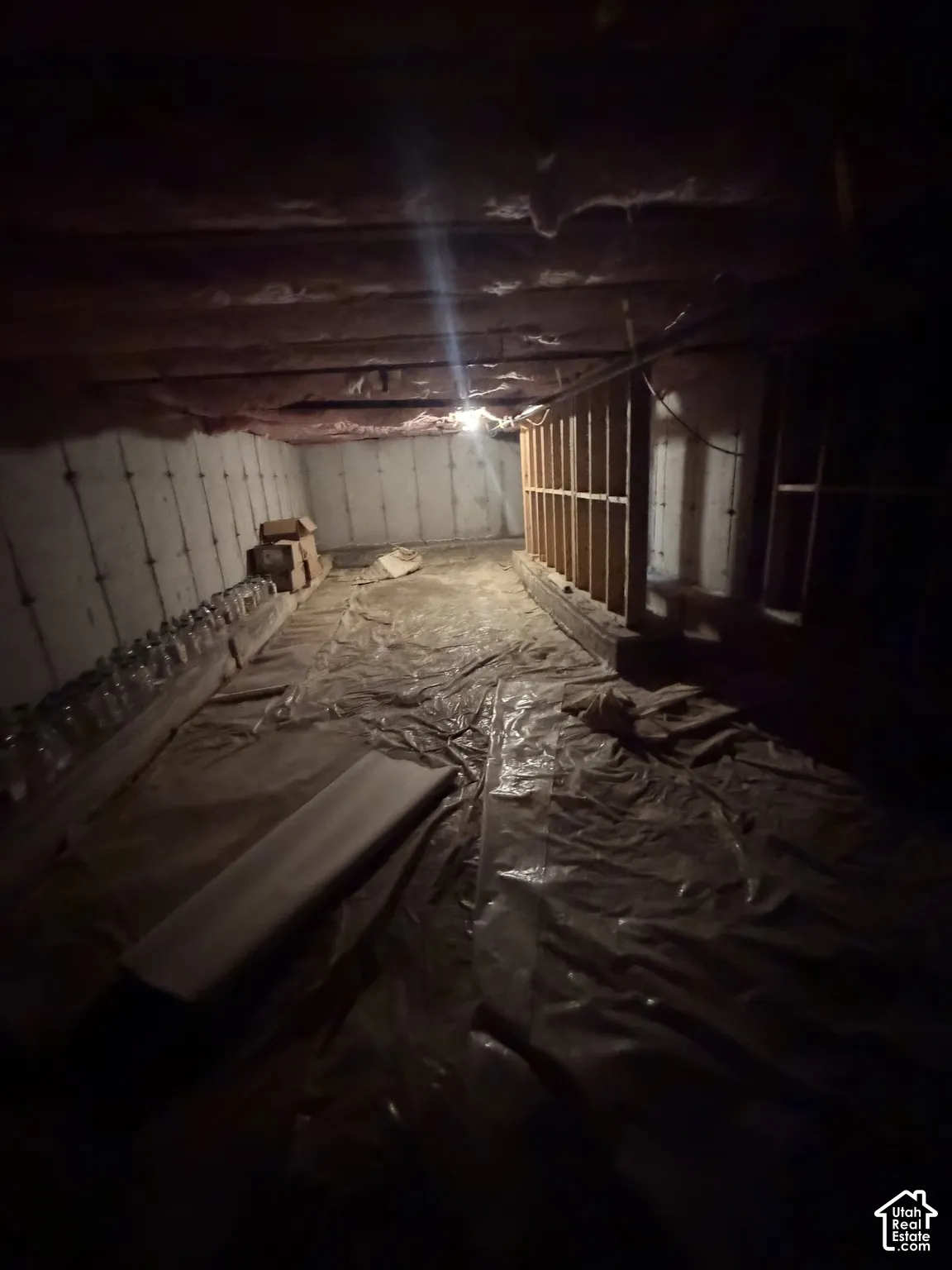Not high enough to qualify as a basement, but a very spacious crawling space with plenty storage room.