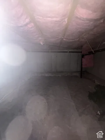 Not high enough to qualify as a basement, but a very spacious crawling space with plenty storage room.