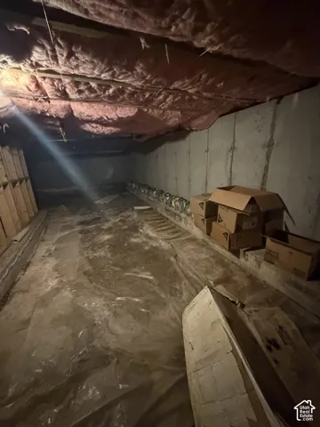Not high enough to qualify as a basement, but a very spacious crawling space with plenty storage room.