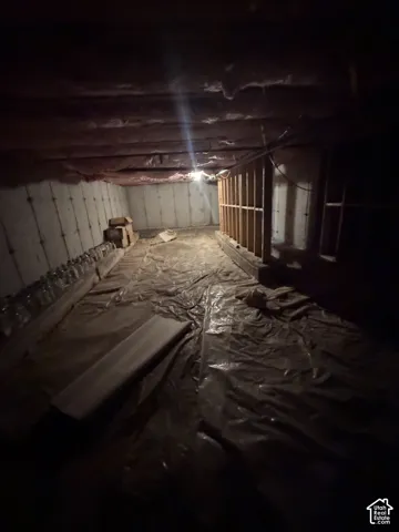 Not high enough to qualify as a basement, but a very spacious crawling space with plenty storage room.