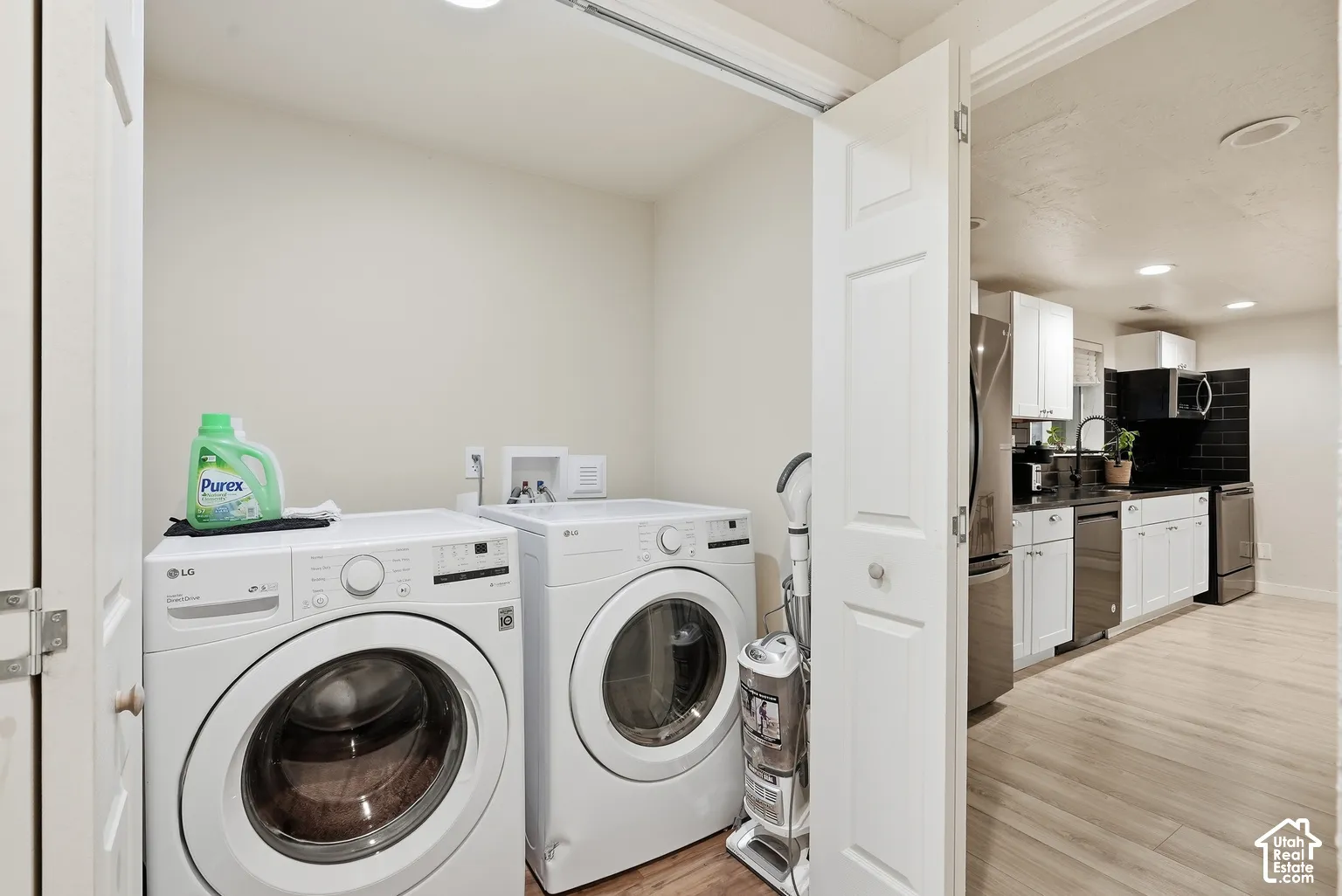 Dedicated laundry area featuring a washer and dryer