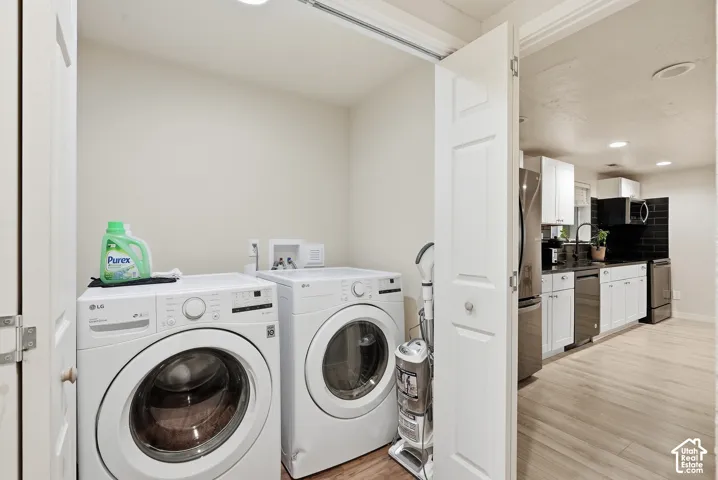 Dedicated laundry area featuring a washer and dryer