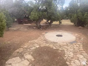 Stone pathway leading to a circular fire pit
