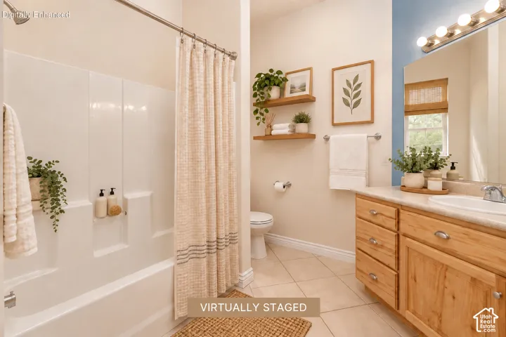 2nd bathroom with tub and shower combination with a curved shower rod, wood-finish vanity with a single basin sink, light-toned countertop, and tiled flooring