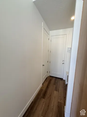 Wood-finish flooring with white trim detailing