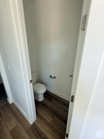 White walls with wood-finish flooring
