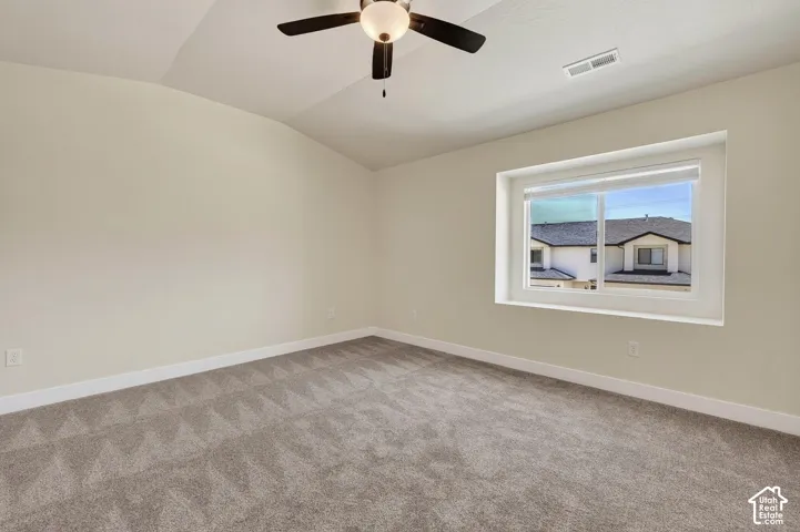 Angled ceiling with a central ceiling fan and light fixture