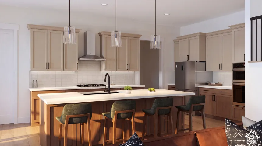 Kitchen featuring a large island with seating, a gas range with a stainless steel hood, built-in wall oven and microwave, and a paneled refrigerator