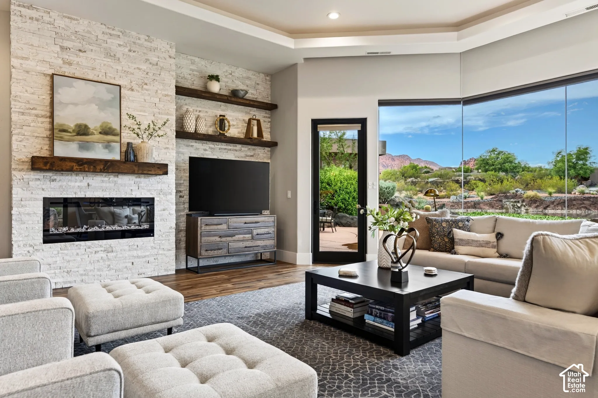 Stacked stone fireplace with a wood-beam mantel