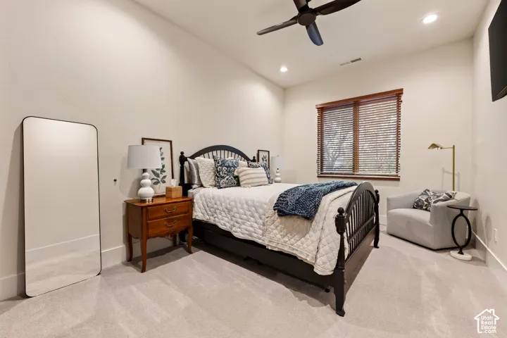 2nd Bedroom: Recessed lighting illuminates the room with neutral-toned walls and light-colored carpeting